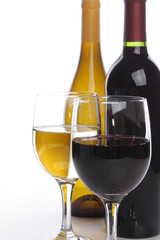 Two wine bottles with glasses