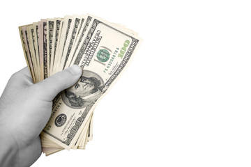 A handful of cash isolated over a white background.