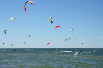 People kiteboarding