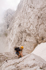 female climbing ferrata in julian alps, slovenia