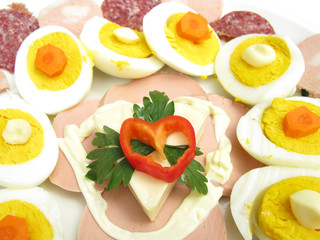 Cold dish with eggs, mayonnaise, carrots and dried meat
