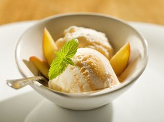 refreshing peach ice cream in a bowl close up