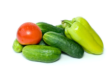 Cucumbers, sweet pepper and tomato isolated on the white
