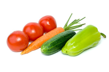 Tomatoes, carrot, cucumber and pepper isolated on the white