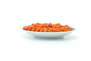 Fototapeta na wymiar Saucer with sea buckthorn berries isolated on the white