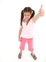Young girl giving thumbs up smiling
