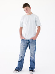 Fototapeta premium Teenage boy standing with hands in pockets