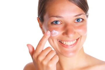 Photo of the beatifull woman with cream on face