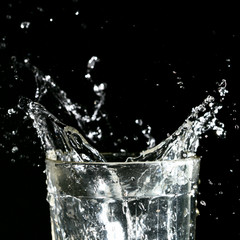 splash in glass on dark background