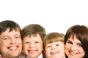 Faces of four family members laughing