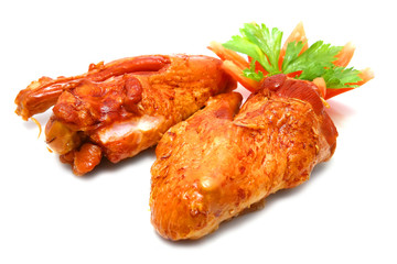 two roasted turkey wings isolated and tomato cut