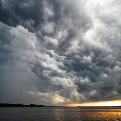 View of thunderstorm clouds above water