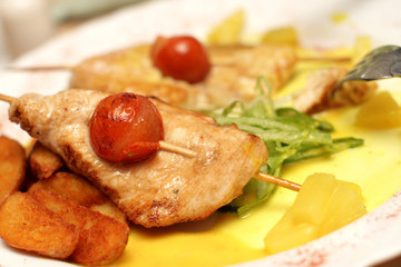 The chicken dish with tomatos in a restaurant