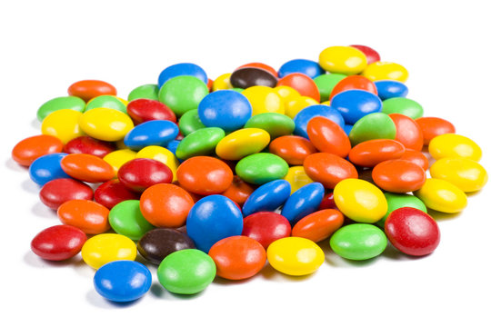 Assortment of Colorful Chocolate Candy on White Background