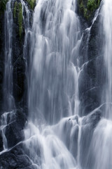 Fototapeta na wymiar An impressive waterfall in the alps