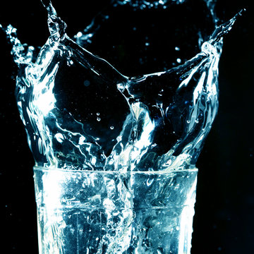splash in glass on dark background
