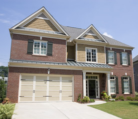 A nice brick two story house with wood trim