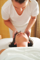 Obraz na płótnie Canvas beautiful woman have massage at spa and wellness center