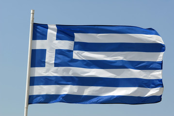 Waving flag of Greece isolated over blue sky