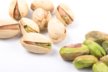 Several pistachio nuts isolated on white