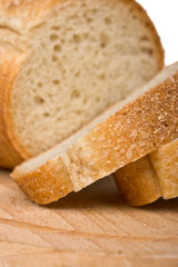Sliced bread on wooden plate - shallow depth of field