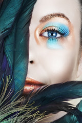 Beautiful woman with blue and bronze metallic eyeshadow