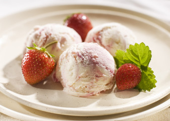 fresh strawberry ice cream on a plate close up