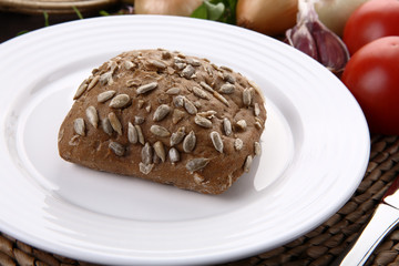 Fototapeta na wymiar Wholewheat bread and fresh vegetables
