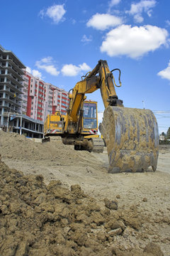 the heavy building bulldozer at a construction site