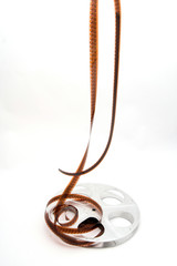 Vintage movie film and reel on white