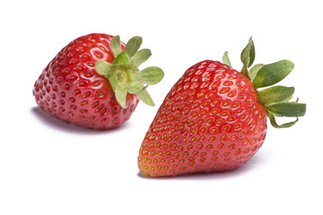 Two ripe strawberries on white background