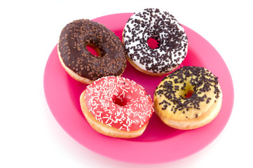 doughnuts at a pink plate
