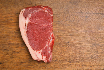 Red and Tasty Steak on a Wooden Table