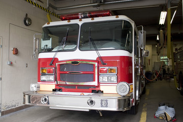 A fire truck is parkedwith all of the fire fighting equipment
