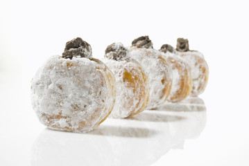 A line of temptingly delicious strawberry-filled donuts