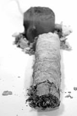 Angle perspective of ash of some dying end cigar.