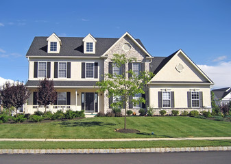 Front of a spacious, upscale suburban home.