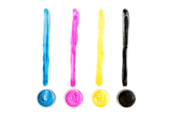 CMYK-colored paints isolated on white background