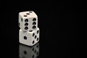 Stacked White Dice on Black Background
