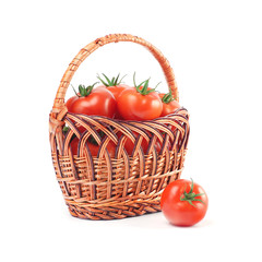 Red ripe tomatoes in a basket isolated over white