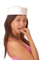 Fototapeta premium Beautiful young Asian girl wearing a sailor's cap
