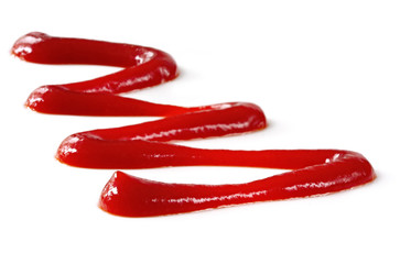 A zig-zag of tomato ketchup, on white.