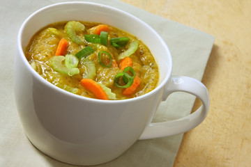 Mug of vegetable soup.