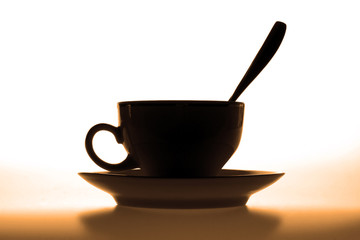 Silhouette of a coffee cup on a white background