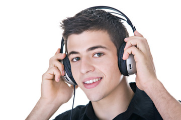 Young man, enjoying music with headphones. Isolated on white.