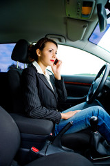 young woman phoning in the car 1