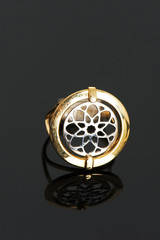 Fototapeta premium Golden ring on the highly reflective background