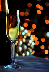 Glass and bottles of champagne