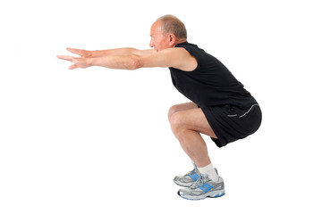 Fit senior man doing a squat © Andrei Nekrassov