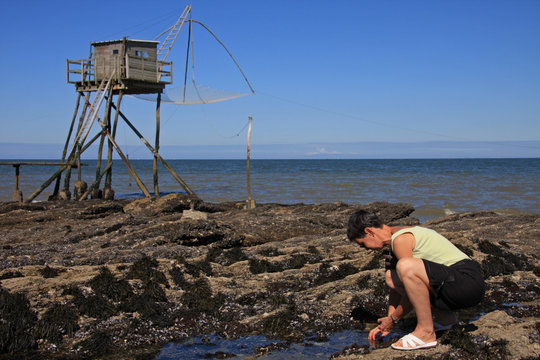 P&ecirc;che aux moules devant une p&ecirc;cherie